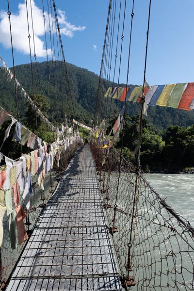 Prayer-Flag Suspension Bridge Over a Mountain River, Punakha District (Bhutan) Yebisa, Bhutan