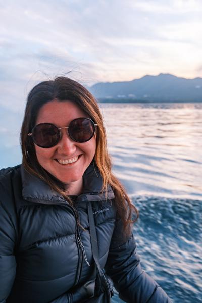 Smiling passenger on a sunset boat ride in Udaipur, India Udaipur, India